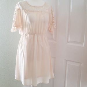 Cream lace dress with pearl button detail